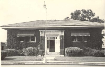 black & white photo of small library building