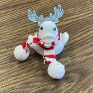 white duck with horns and scarf, links to more information