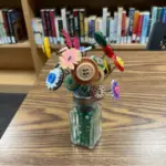 A button flower arrangement in a salt shaker, links to more information
