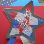 Photo shows an art project of a star decorated with tissue paper