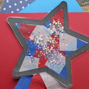 Photo shows an art project of a star decorated with tissue paper