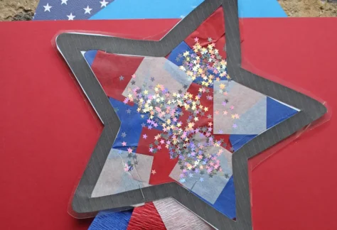 Photo shows an art project of a star decorated with tissue paper