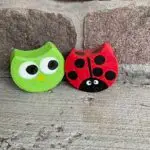 Image of a ladybug and an owl painted on concrete paving bricks