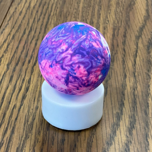 Blue, pink, and purple swirled ping-pong ball on a small tea light, links to more information