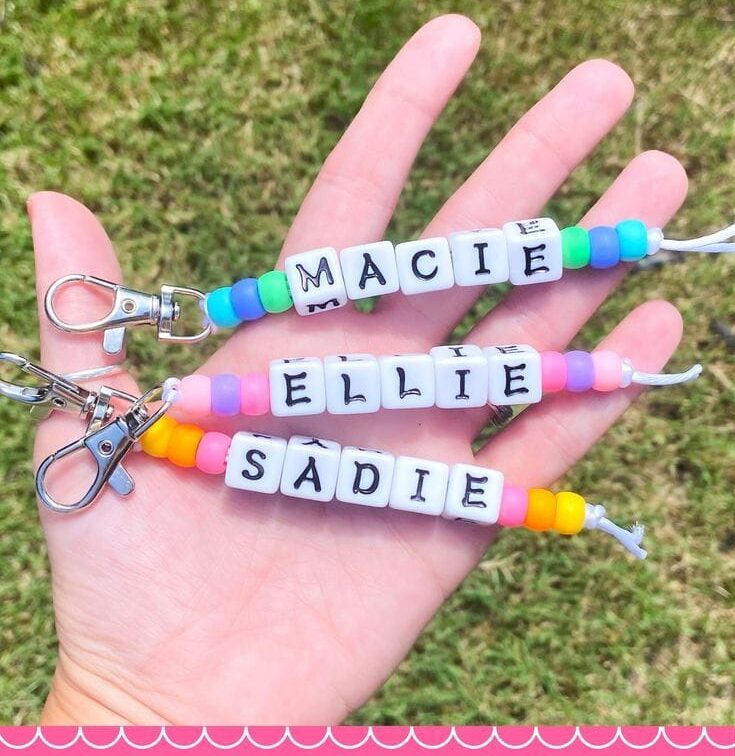 Image of 3 beaded keychains with name beads.