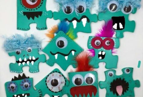 Image shows puzzle pieces decorated as monster faces
