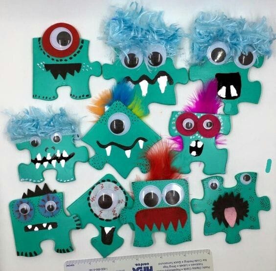 Image shows puzzle pieces decorated as monster faces