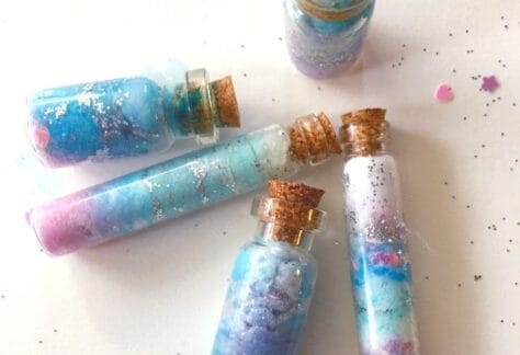 Image of a tiny bottle filled with colorful glitter