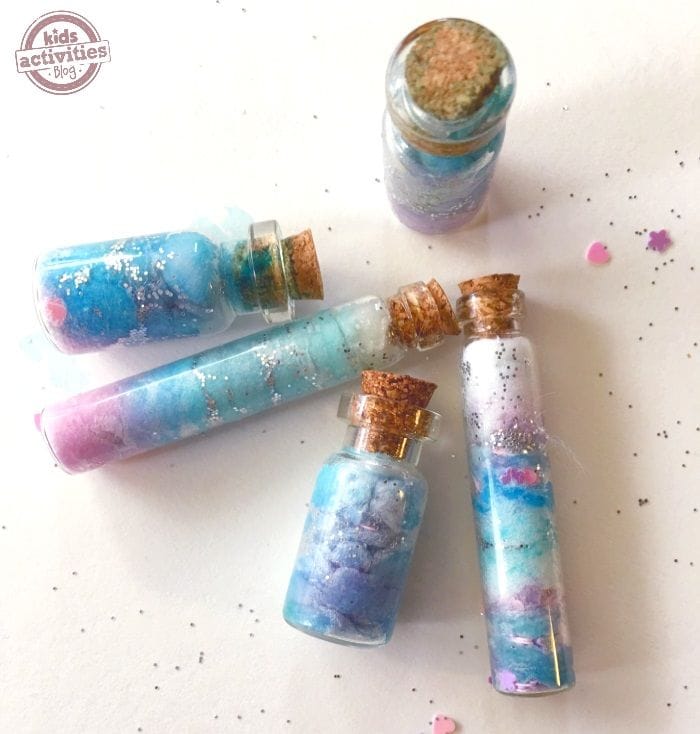 Image of a tiny bottle filled with colorful glitter