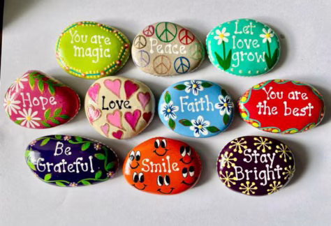 Image of rocks painted with inspirational messages